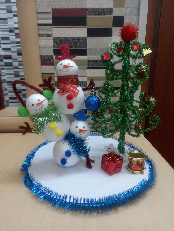 there is a snowman and other decorations on the table