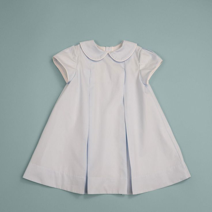 Our little girl's pleated dress is perfect for church or any special occasion. This fully lined dress has inverted front and back pleats and stylish short cap sleeves, also with pleats. It closes at center back with buttons. Both dress and lining are 100% cotton. Fitted Short Sleeve Puff Sleeve Dress, Classic A-line Dress With Accordion Pleats, Classic A-line Dress With Box Pleat, Cotton Short Sleeve Dress With Pleated Waist, Cotton Dress With Pleated Waist And Short Sleeves, Classic A-line Dress With Pleated Back, Classic Short Sleeve Dress For Dress-up, Classic Fitted Pleated Dress With Accordion Pleats, Cotton A-line Dress With Box Pleat