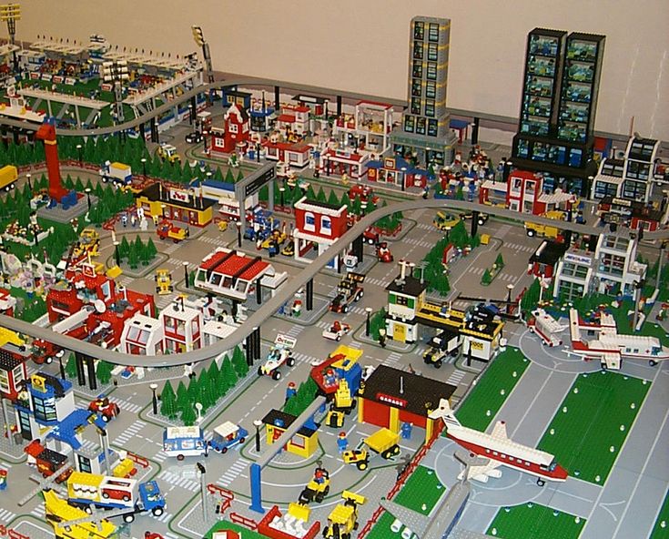 a large model city is shown with cars and trucks