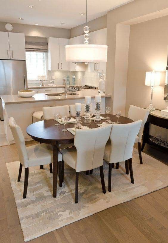 a dinning room table with chairs and lights