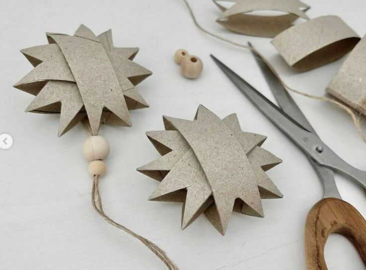 the crafting supplies are laid out on the table to be used for making ornaments