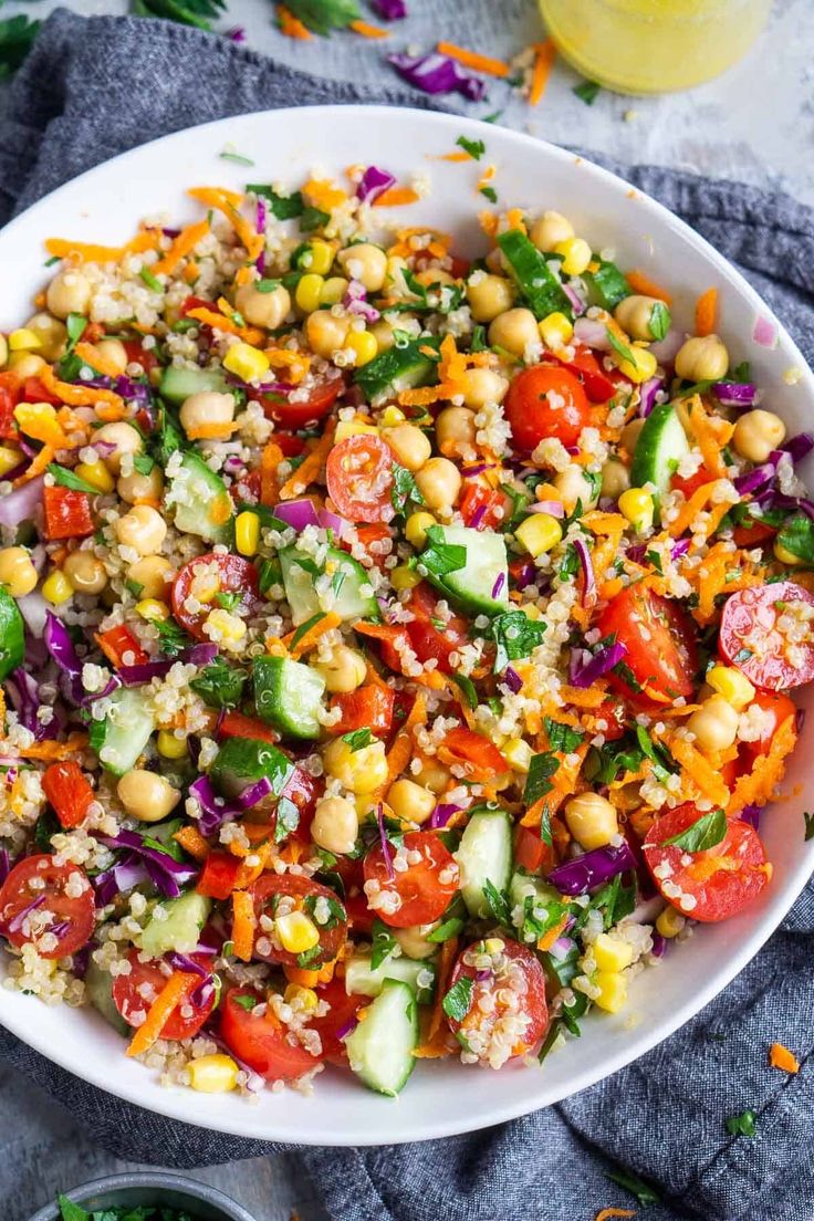 a white bowl filled with couscous and vegetables