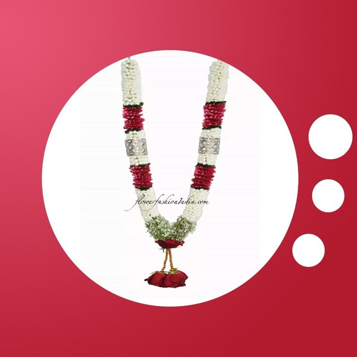 a red and white necklace with flowers on it next to two circles in the background