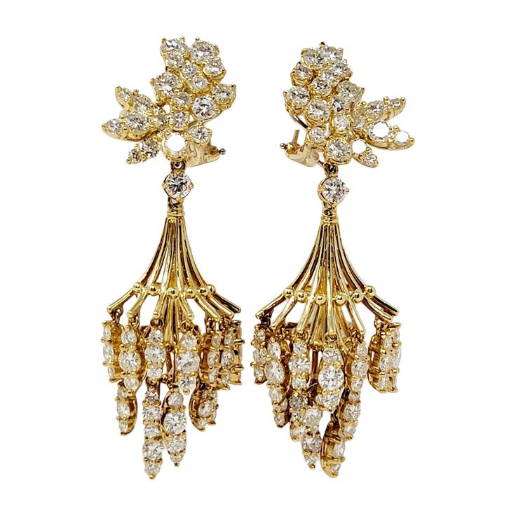 Luxurious, Old World style diamond chandelier earrings are bursting with undeniable sparkle. These exquisite earrings are simply stunning, featuring a unique cluster of icy white diamonds, paired with a cascading spray of additional dangling gemstones. The gentle movement and length reflects the diamonds from all angles, making them sparkle beautifully on the ear. The top portion of the pair features shimmering natural round diamonds prong set in tight cluster. An 18 karat yellow gold chandelier Gentle Movement, Diamond Chandelier Earrings, Diamond Chandelier, Elegant Chandeliers, Jewelry Appraisal, Old World Style, 11 59, Gold Chandelier, Pear Shaped Diamond