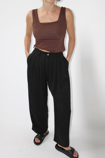 Luxury Pleated Pants For Fall, Luxury High Waist Belted Pants, Luxury Pants With Belt Loops For Fall, Luxury High Waist Pants With Side Pockets, Luxury Versatile Relaxed Fit Pants, Luxury Relaxed Fit Pants With Elastic Side Panels, Luxury Relaxed Fit Pants With Elastic Waistband, Versatile Luxury Pants With Side Pockets, Classic Luxury Pants With Belt Loops