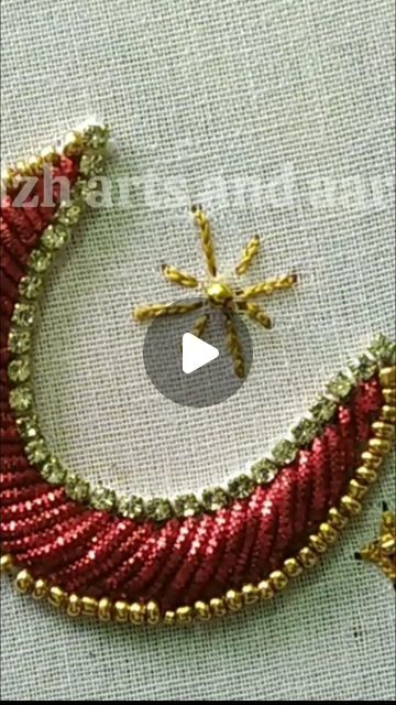 beaded christmas tree ornament with red and gold trimmings on white fabric