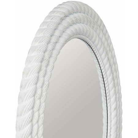 a white rope mirror hanging on a wall