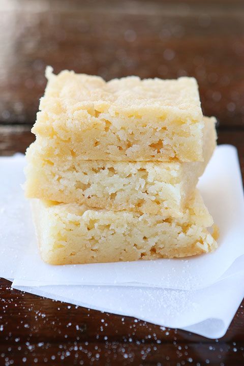 three pieces of cake sitting on top of a white napkin