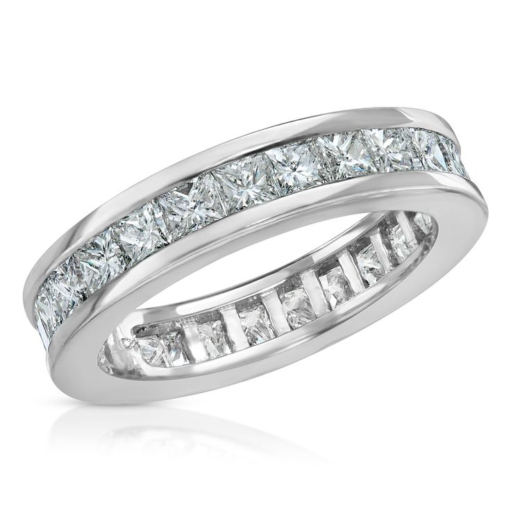 a white gold ring with princess cut diamonds