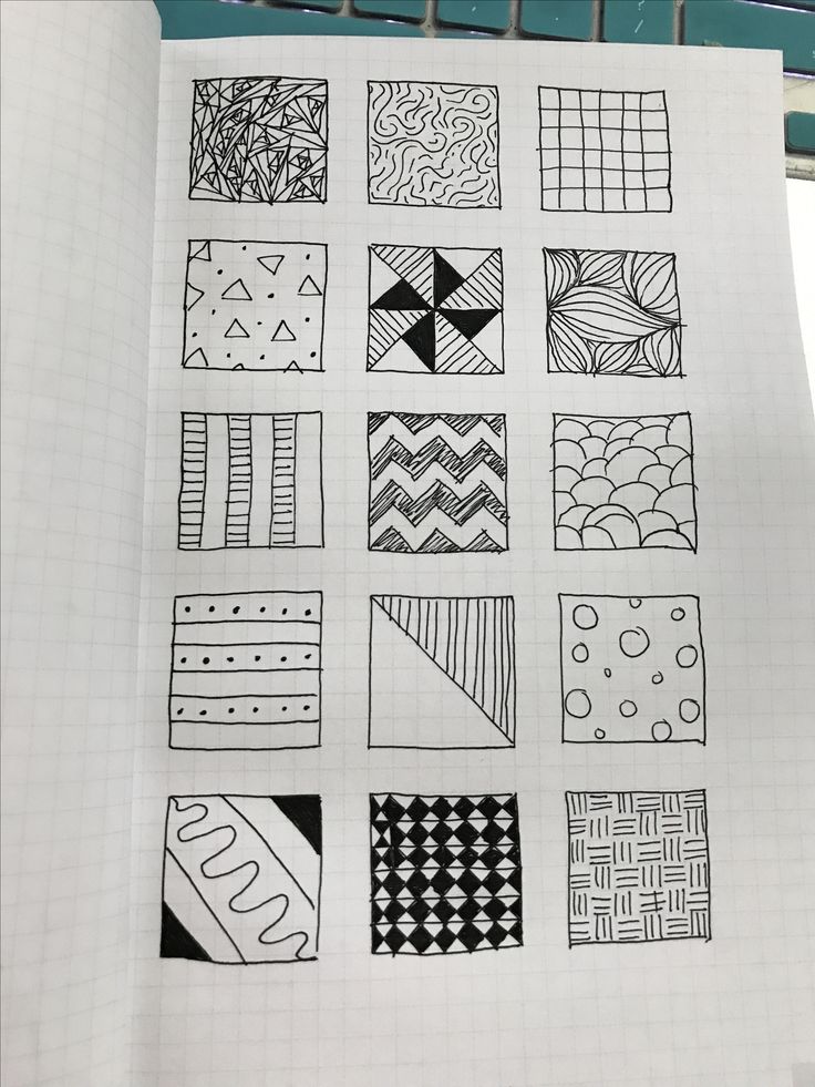 a notebook with some drawings on it and one is black and white, the other has different patterns