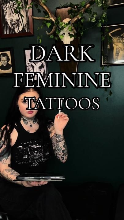 a woman sitting on a couch holding a laptop computer in front of her face with the caption dark feminine tattoos