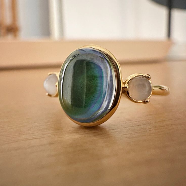 A dreamy mood ring set with an oval color changing mood stone in between two moonstones. This is our grown up version of the classic mood ring with a whimsical vibe. Gorgeous and when worn solo or the perfect compliment when stacked with multiple rings. Mood stone measures 10mm tall. Our materials make for an amazing, high quality, seamless, jewelry piece with longevity. Our rings are plated with 18k gold, 18k rose gold, or sterling silver and finished with a protective coating. A little secret Printable Ring Size Chart, Classic Mood, Mood Stone, Multiple Rings, Mood Ring, Twist Ring, Ring Sale, Delicate Jewelry, Shoes With Jeans