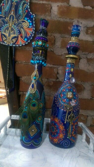 three colorful vases sitting on top of a table