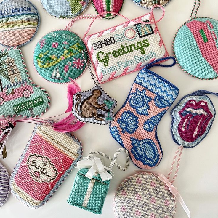 many different types of embroidered badges on a white surface