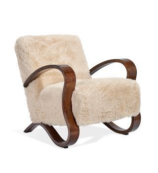 a white chair with a wooden frame and sheepskin upholstered armrests