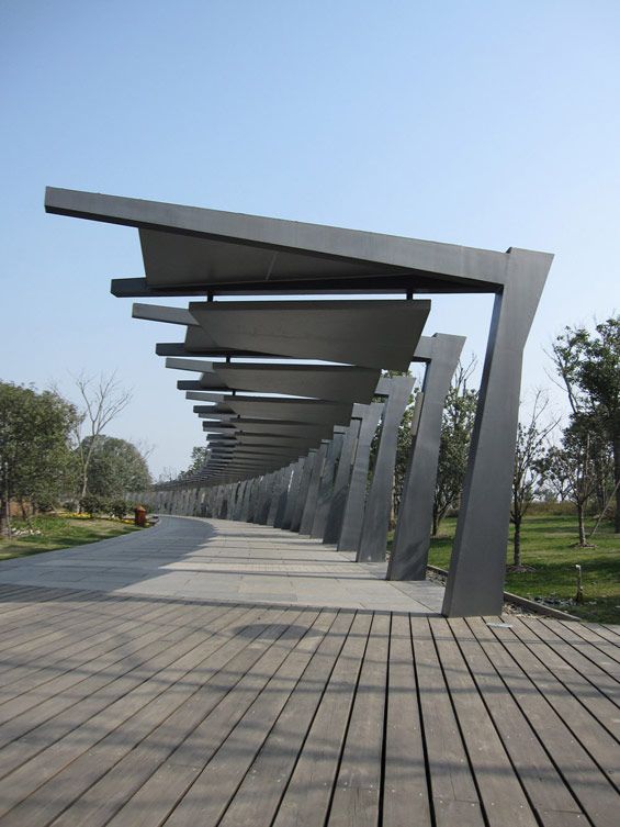 the walkway is lined with black metal structures