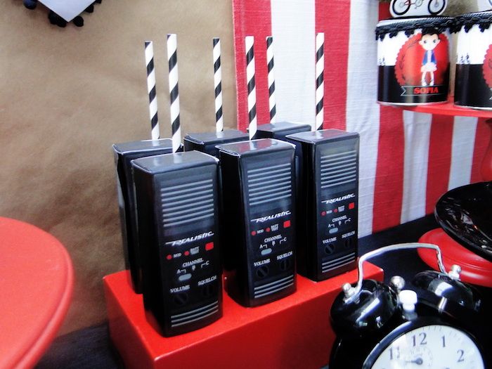 three old fashioned radio recorders are on display in front of an american flag backdrop