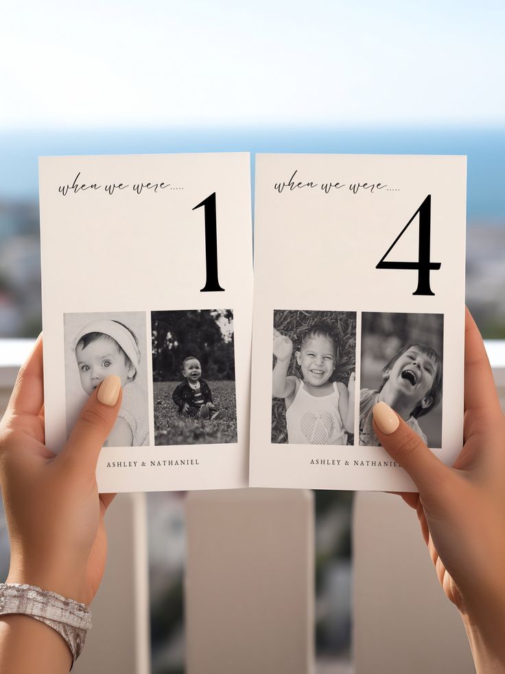 a person holding up an open photo book with pictures on the front and back of it