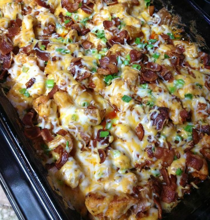 loaded chicken and potatoes casserole in an oven with text overlay that reads loaded chicken and potatoes