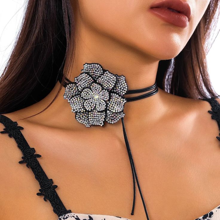 Add a touch of disco glamour to your party look with the Chic Rhinestone Rose Choker Necklace. This stunning piece, featuring full rhinestones and a bold rose centerpiece, adds sparkle and allure to your outfit. The adjustable black leather wax rope ensures a comfortable fit, making it the perfect accessory for a disco-themed party. Stand out and shine on the dance floor with this elegant choker. total length 180 cm. Rose Choker, Flower Choker Necklace, Flower Model, Rhinestone Rose, Y2k Accessories, Flower Choker, Velvet Flowers, Gothic Necklace, Neck Jewellery