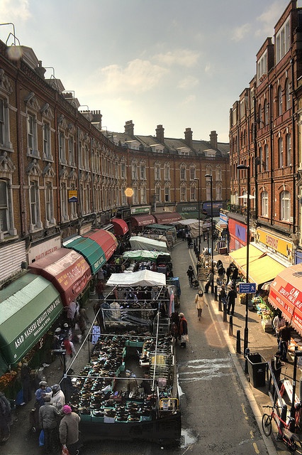 an outdoor market in the middle of a city