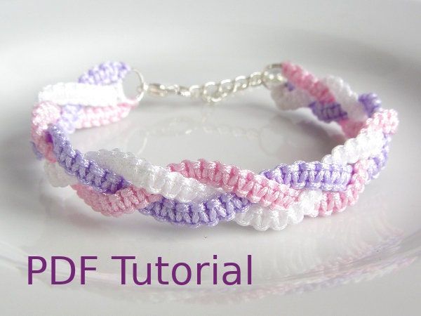 the bracelet is made with pink, white and purple seed stitchs on silver plate