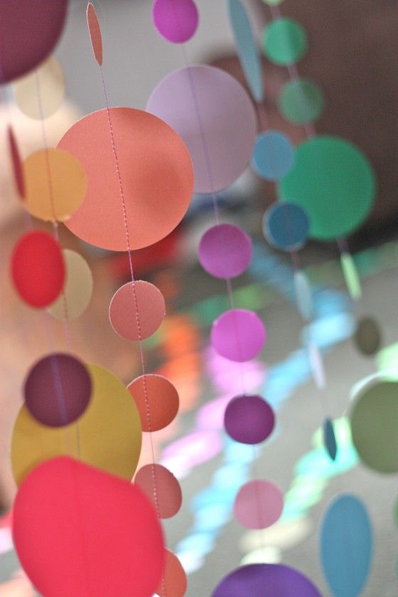 multicolored paper circles hanging from strings