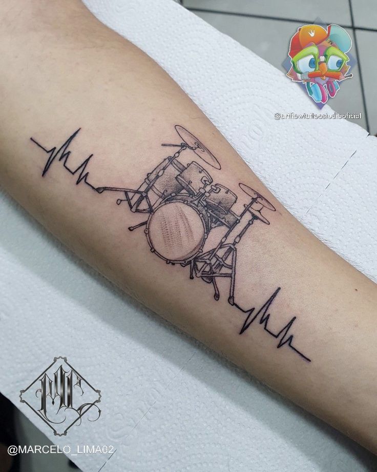 a drummer's drum tattoo on the arm with heartbeats and drums in black ink