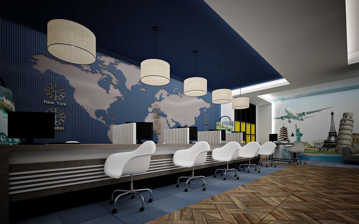 an empty waiting area with chairs and tables in front of a world map on the wall