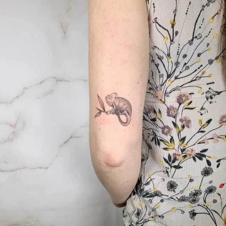 a woman with a small tattoo on her arm