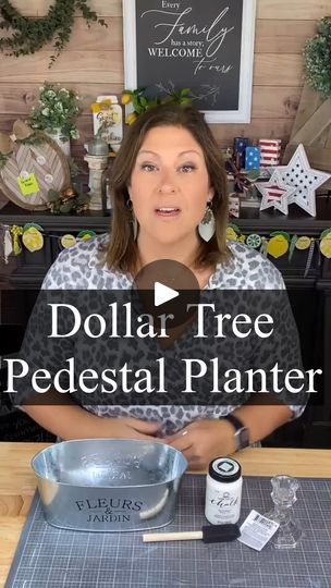 a woman sitting at a table in front of a sign that says dollar tree pedestal