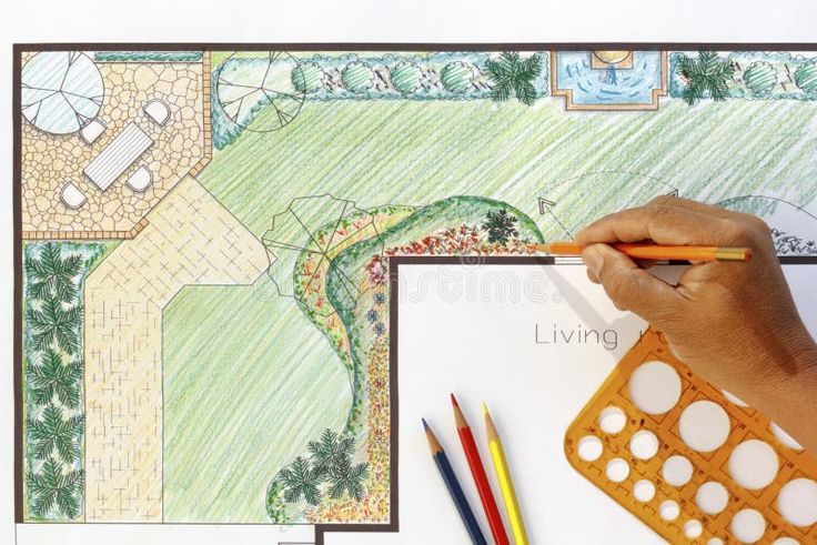 a person is drawing a landscape with colored pencils and markers on a white paper