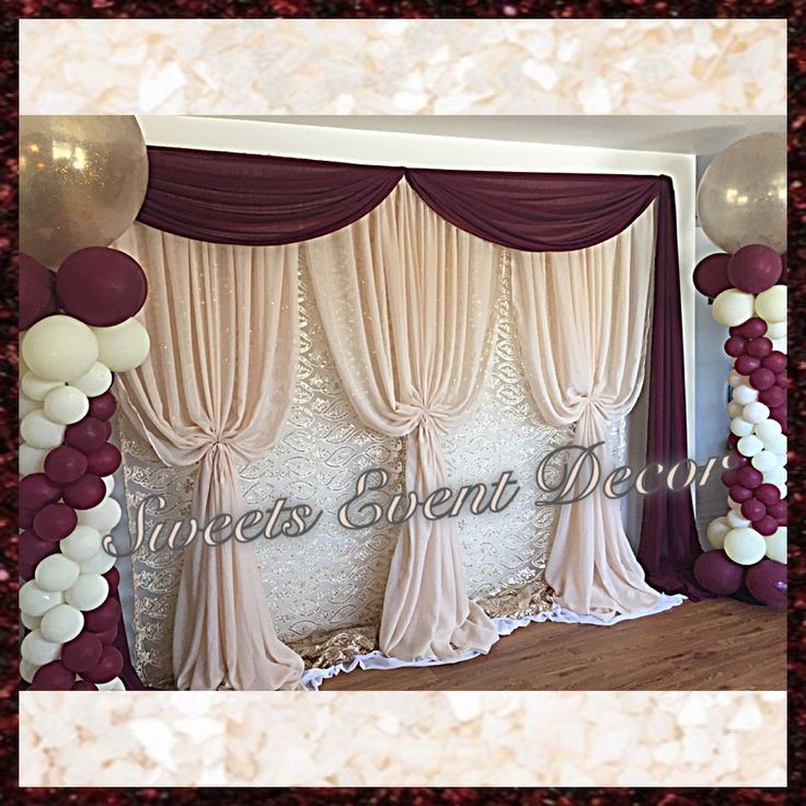 the backdrop is decorated with balloons and streamers for an elegant wedding or party venue