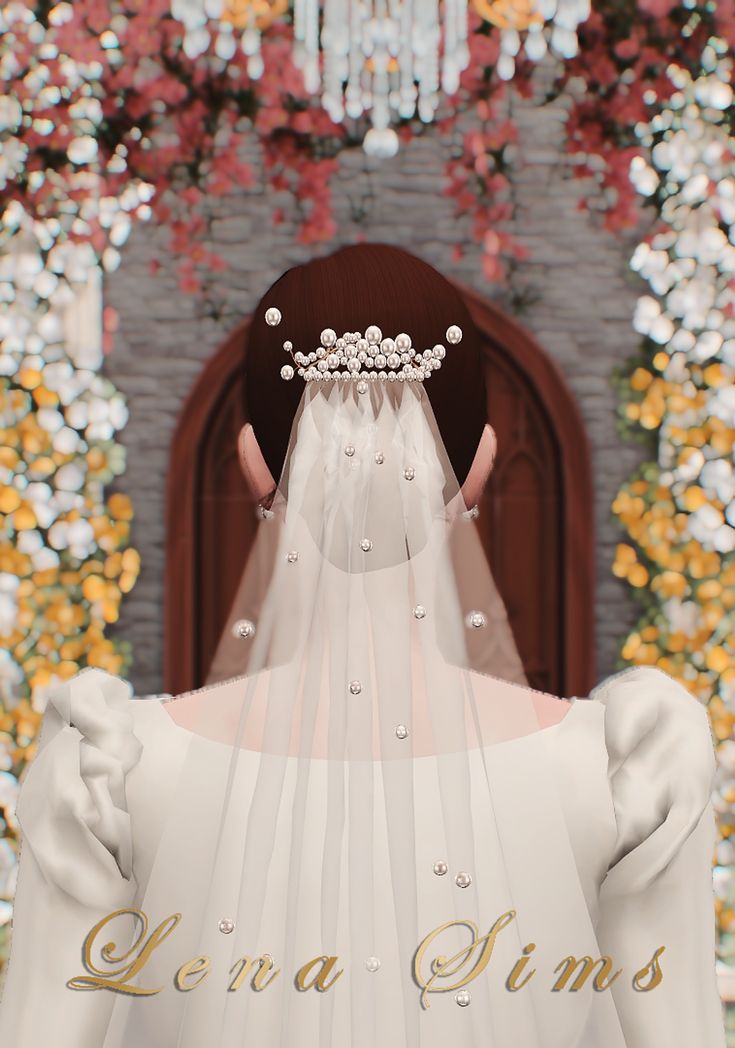 the back of a bride's wedding dress in front of a floral wall with flowers