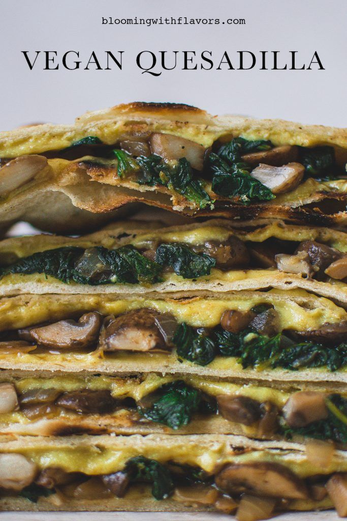 three quesadillas stacked on top of each other with mushrooms and spinach