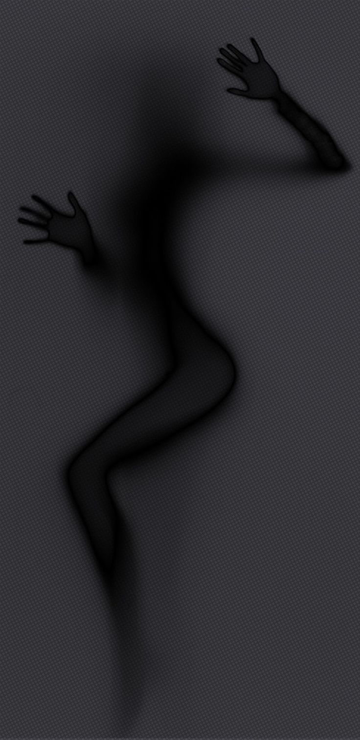 a blurry image of a person with their arms out in the air and hands outstretched