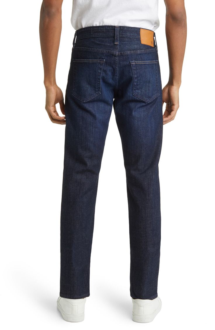 A classic faded wash elevates stylish jeans cut from stretchy Japanese denim for a flexible feel. 13" leg opening; 9 1/2" front rise; 14" back rise ( size 29x33 ) Zip fly with button closure Five-pocket style 98% cotton, 2% elastane Machine wash, tumble dry Imported Men's Clothing Dark Wash Straight Leg Jeans With Zip Fly, Dark Wash Straight Fit Jeans, Classic Fitted Denim Jeans, Slim Fit Denim Bottoms With Straight Hem, Classic Slim Dark Wash Bottoms, Classic Dark Wash Slim Bottoms, Classic Stretch Jeans In Dark Wash, Classic Slim Fit Dark Wash Bottoms, Classic Slim Fit Jeans With Standard Cut Leg