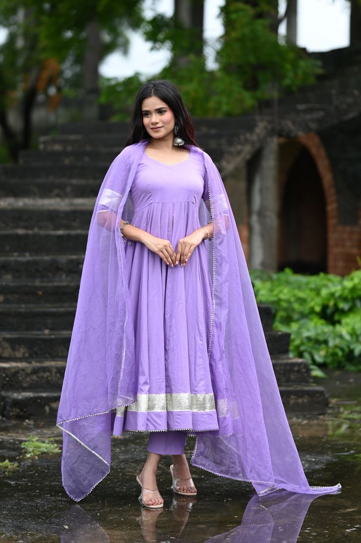 PRODUCT DESCRIPTION :-Shine bright like sunshine!Anarkali :- Pure cottonPant :- CottonDupatta :- Organza silkClosure Used:- Side zipColor:- Lilac purpleCare Instructions :- Dry clean onlyModel Size :- Model is wearing XS sizeModel Height :- 5.5DISCLAIMER :- Slight color variations may occur due to different screen resolution. Purple Chanderi Churidar With Mirror Work, Designer Purple Sharara With Self Design, Festival Purple Churidar With Mirror Work, Purple Anarkali Set With Straight Kurta, Purple Anarkali Set For Festivals With Straight Kurta, Semi-stitched Anarkali Sharara In Lavender, Semi-stitched Lavender Anarkali Sharara, Anarkali Purple Kurta With Mirror Work, Diwali Purple Straight Kurta Anarkali Set