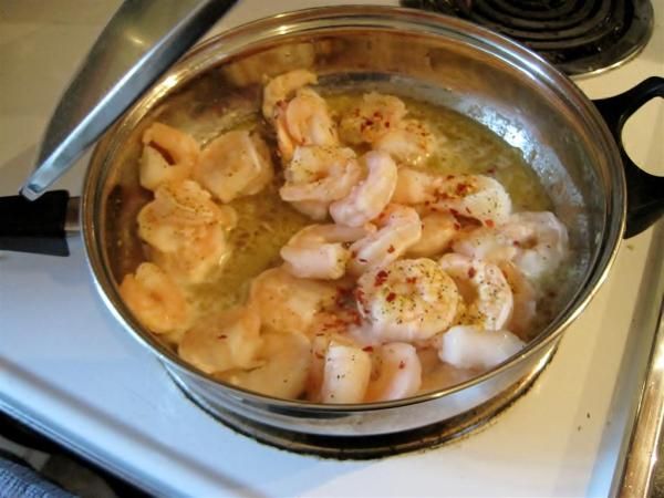 the food is being cooked in the pot on the stove top, and ready to be eaten