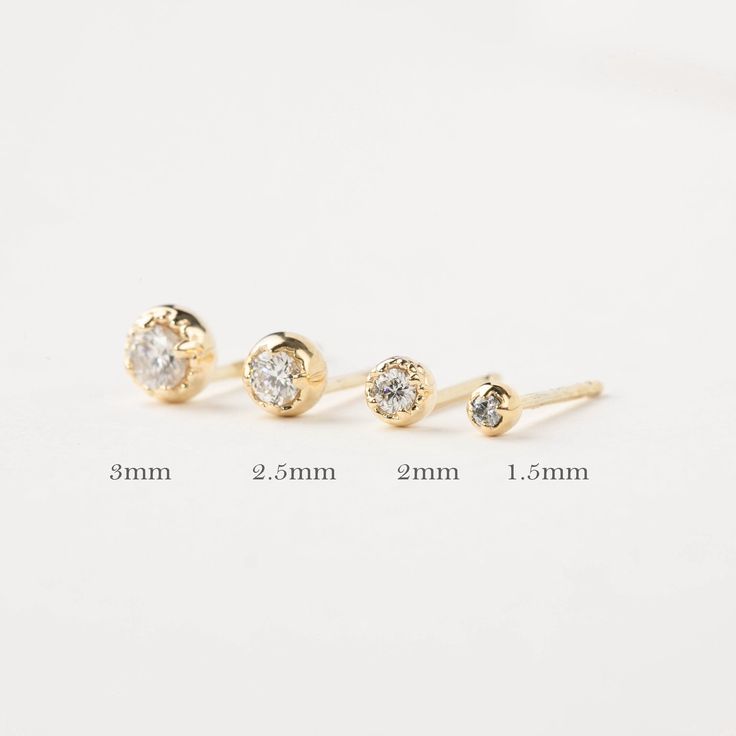 The perfect dainty 14k solid gold diamond studs to jazz up your everyday look. Every woman needs one pair of simple diamond studs to add to their collection. This classic earring makes a sophisticated accessory for women of all ages. Purchase this versatile studs for special occasions such as birthdays, anniversaries, Christmas, Mother's Day, Valentine's Day, or even for bridesmaids! * Sold as a single stud or a pair * 1.5mm diamond weighs 0.015ct, for a pair 0.03ctw. * 2mm diamond weighs 0.04ct Minimalist White Gold 14k Piercings, Minimalist 14k White Gold Piercings, 14k Gold Fine Jewelry Piercings, Rose Gold Diamond Earrings With Single Diamond, Classic Diamond Cartilage Earrings With Prong Setting, Minimalist Diamond Piercings With Single Diamond, Minimalist Diamond Piercing With Single Diamond, Elegant Everyday Diamond Cartilage Earrings, Elegant Round Diamond White Piercings