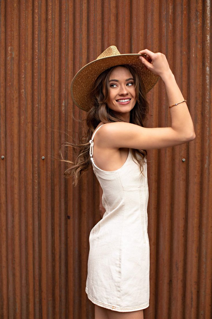 Our Palm Desert Panama fit in perfectly on our latest road trip photo shoot. Stunning, classic, chic - everything you've ever wanted in a hat. Featuring a molded crown with a pinched 10cm brim and hand woven straw, it's crystallized on the tone on tone ribbon with a simple Swarovski rivet. -Rancher style hat with a chill & casual vibe-Brim is flexible but holds its shape-Coordinating ribbon band-Pinched top-Great quality-- will last forever-This color actually goes with everything effortless Casual Fitted Panama Hat For Spring, Fitted Summer Travel Hats, Fitted Short Brim Fedora For Day Out, Fitted Fedora With Short Brim For Day Out, Fitted Flat Brim Sun Hat For Vacation, Casual Fitted Sun Hat For Travel, Chic Fitted Toquilla Straw Fedora, Chic Fitted Panama Hat With Curved Brim, Beige Fitted Country Fedora