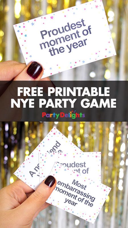 someone is holding up two new year's eve party game cards with the words, free printable nye party game