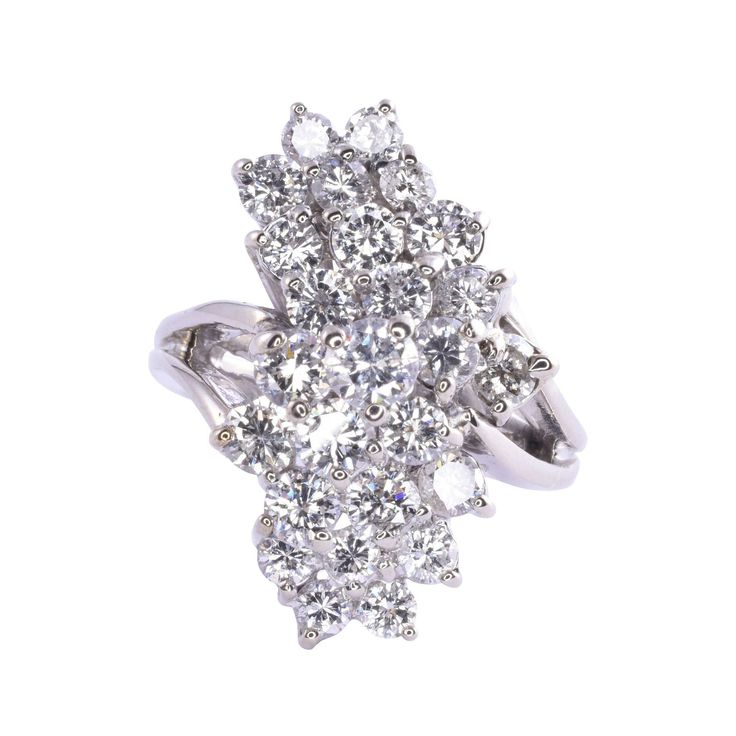 Vintage American waterfall diamond cluster ring, circa 1950. This 14 karat white gold ring features a waterfall of 26 round brilliant cut diamonds at 2.5 carat total weight. The diamonds have VS-SI clarity and G-H color. This vintage diamond cocktail ring is a size 6 and weighs 8.5 grams. [EROS D862] *Resizing available for additional charge. Solvang Ca, Diamond Cocktail Ring, Diamond Cocktail Rings, Diamond Cluster Ring, White Gold Ring, Diamond Cluster, Vintage Diamond, Cluster Ring, Round Brilliant Cut Diamond