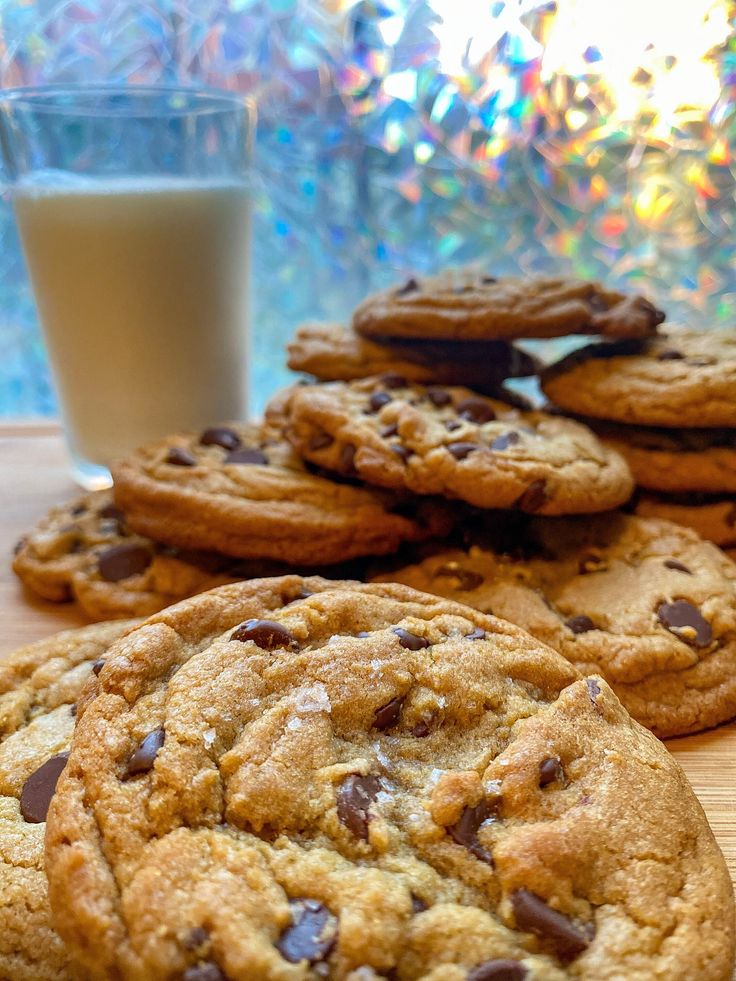 chocolate chip cookies next to a glass of milk