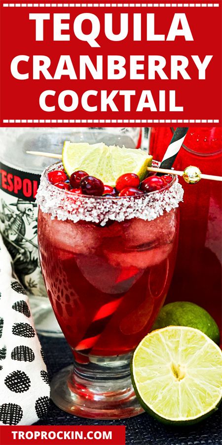 the tequila cranberry cocktail is garnished with limes and cherries