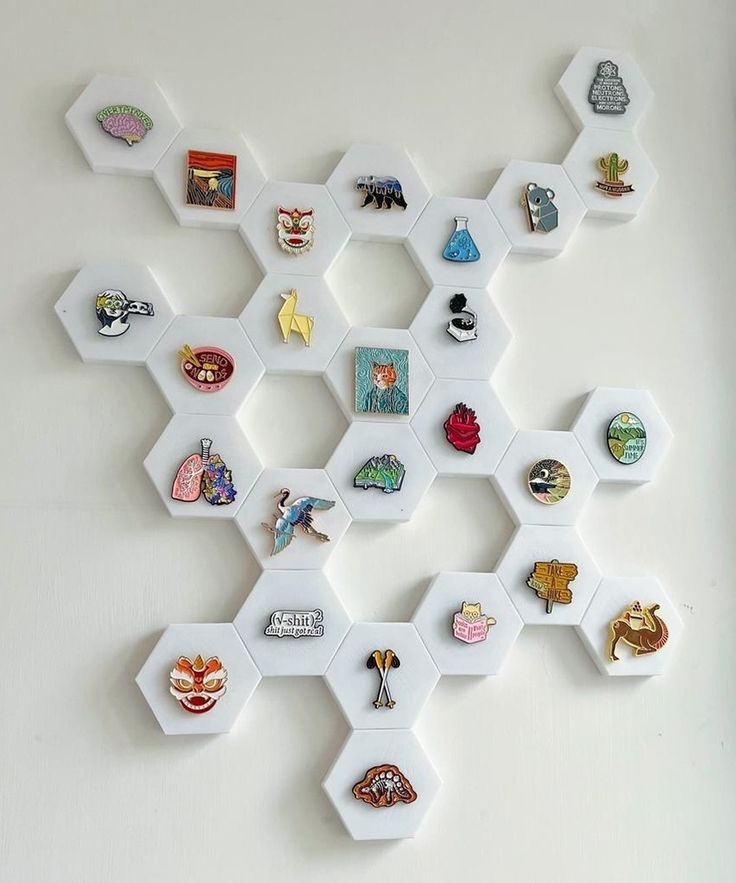 a white wall with several hexagonal magnets on it