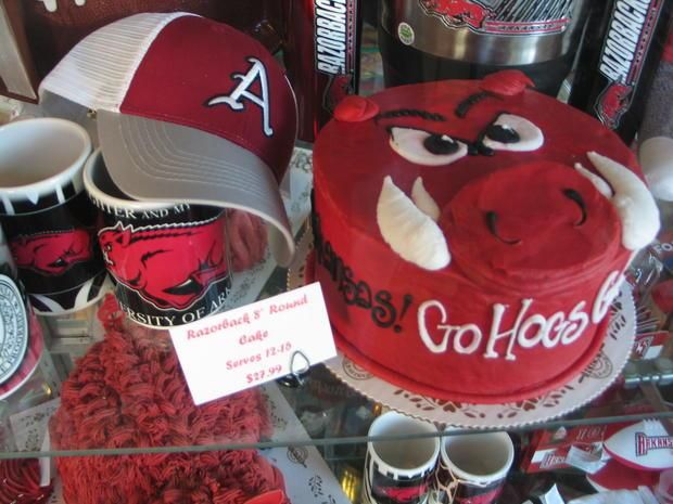 a display case filled with baseball caps and mugs in the shape of bulls head