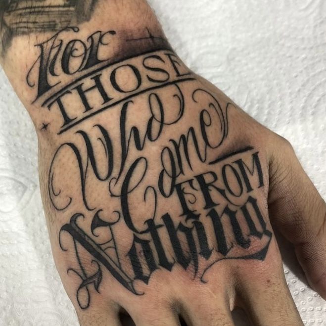 a man's hand with the words who we come from nothing written on it