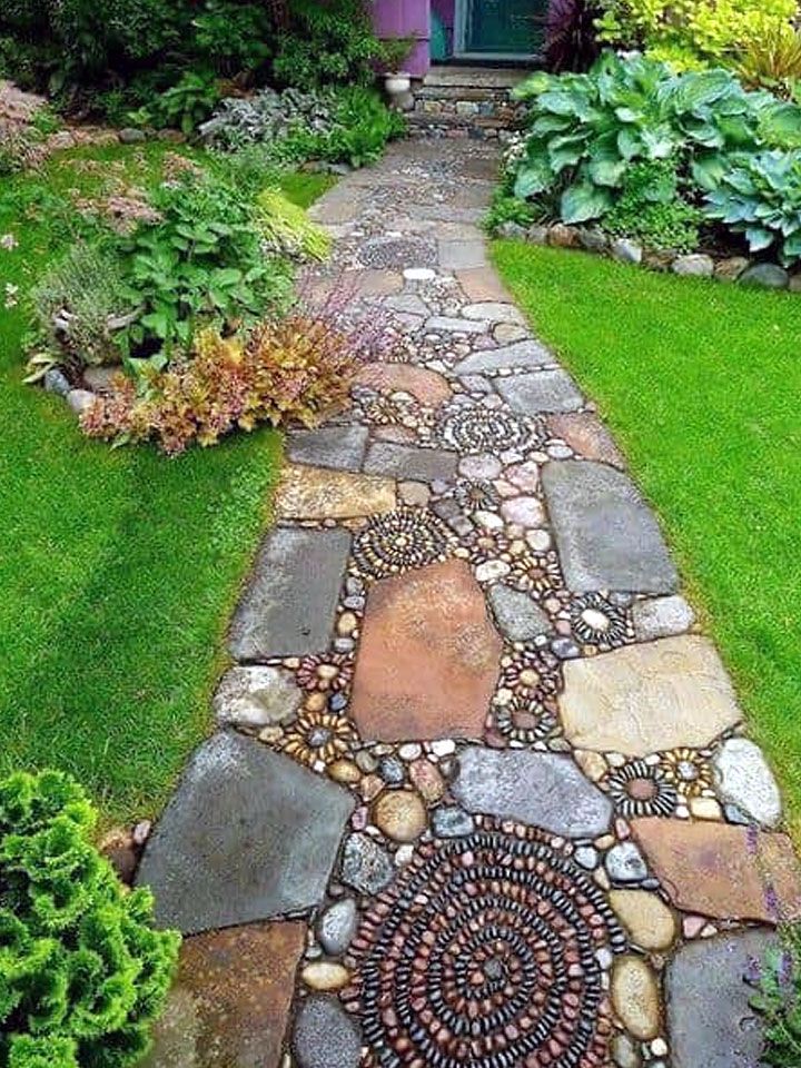 a stone path in front of a house