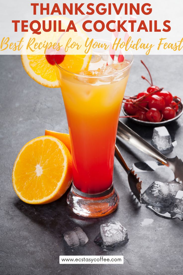 a glass filled with orange juice and garnished with cherries on the side